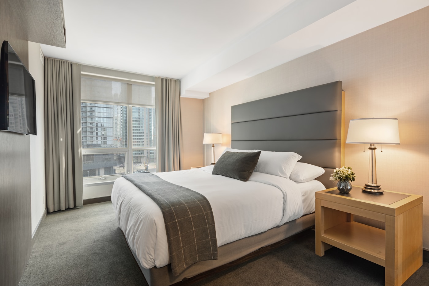 Serene bedroom sanctuary with soft linen textures, warm amber light, and organic materials