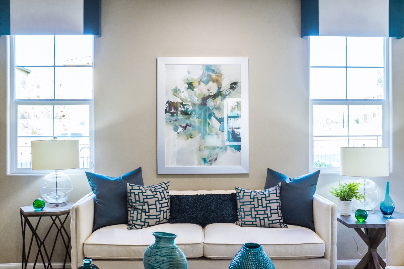 Cozy reading nook with a linen armchair, stone wall, and soft warm lamp light
